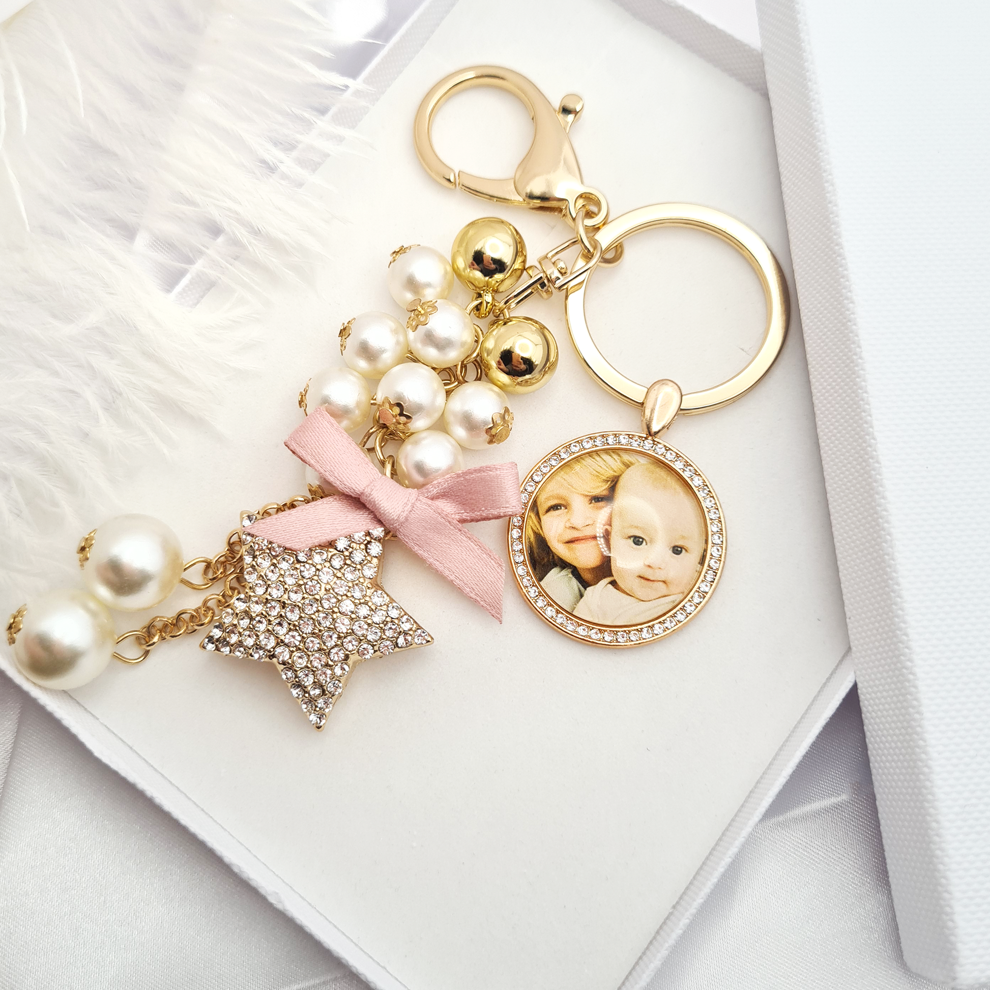 Gold round glitter pendant with pearls, gold balls and a glitter star personalised with a photo set in glass in a white gift box