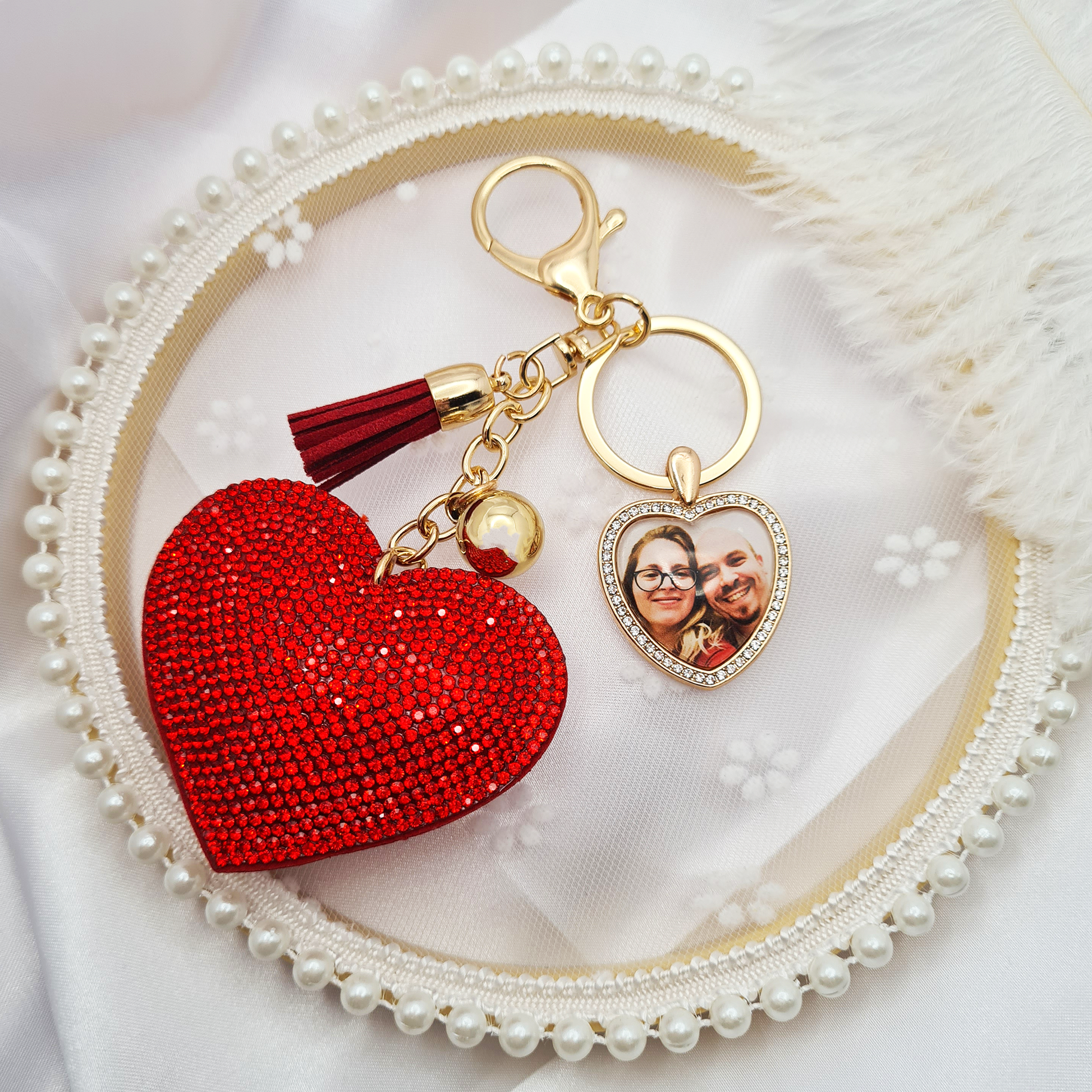 Big red heart with gold heart shaped pendant with a personalised photo in glass on white decorative backdrop