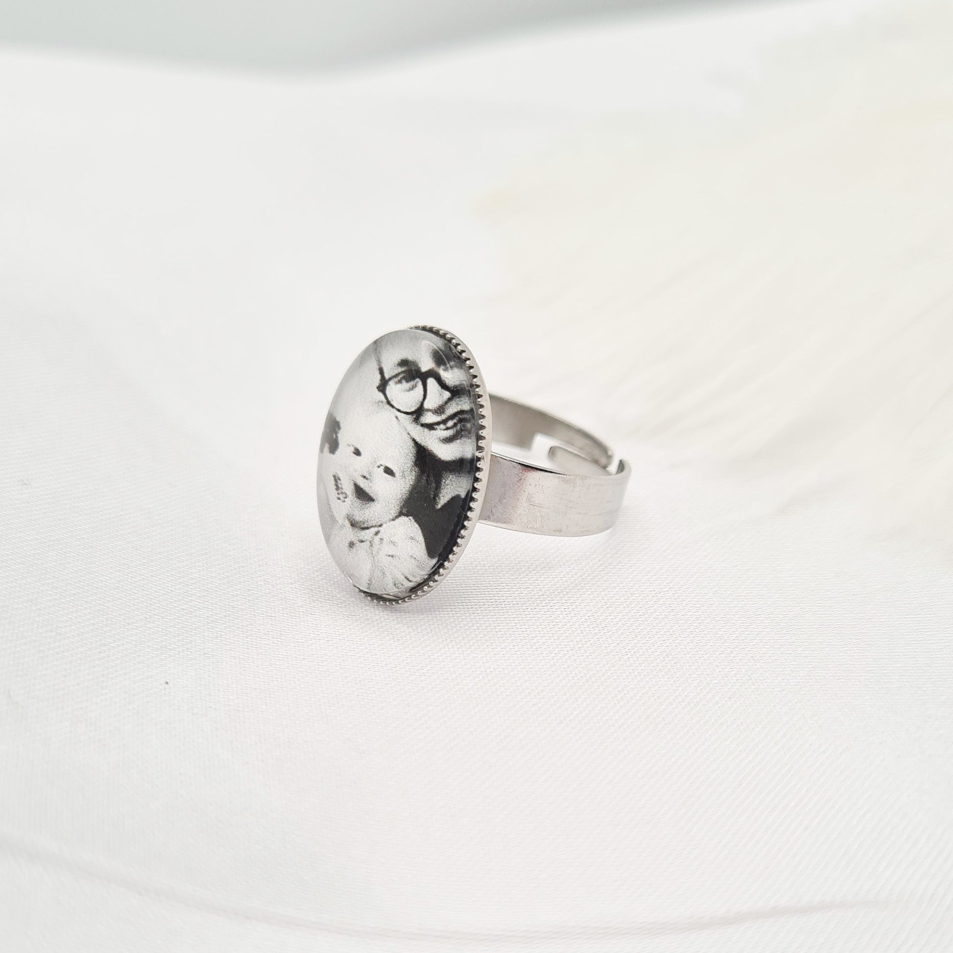 Silver oval ring personalised with a photo set in glass