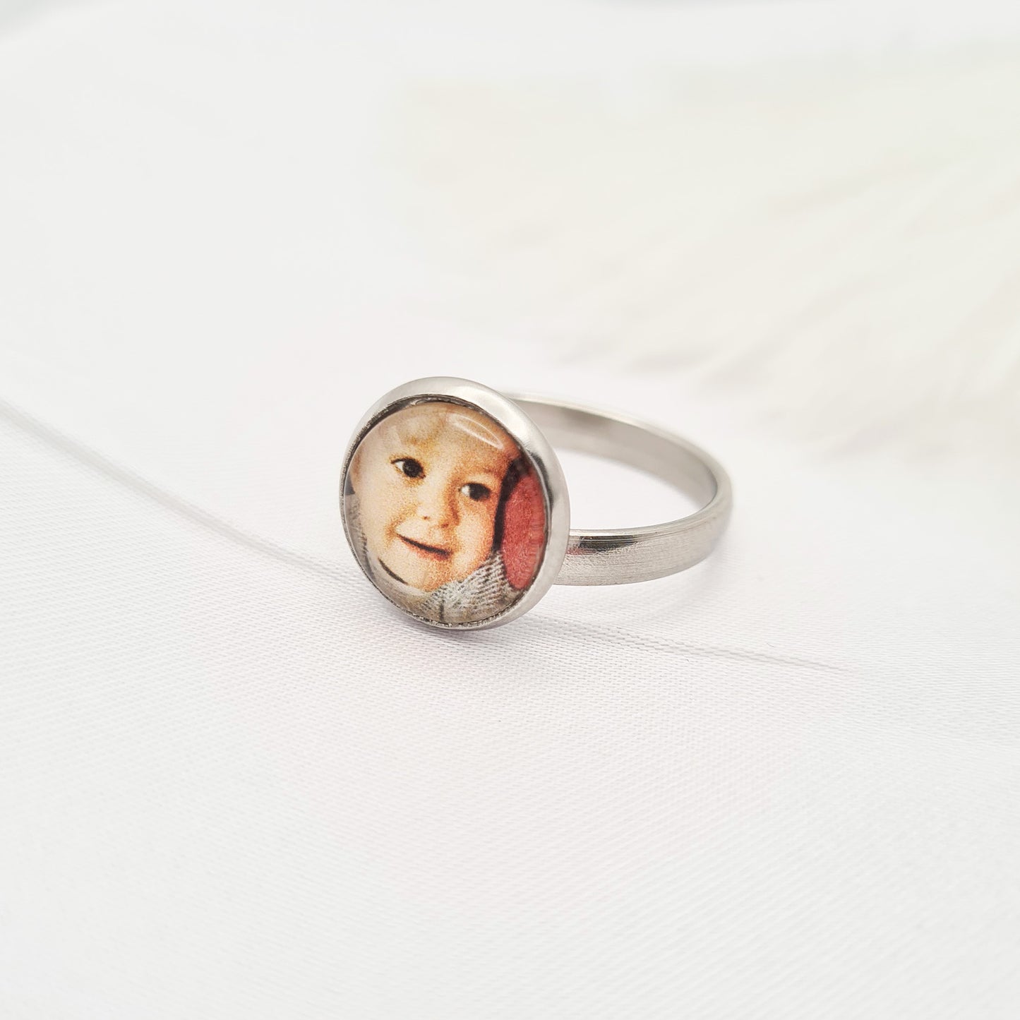 Stainless steel ring personalised with a photo set in glass