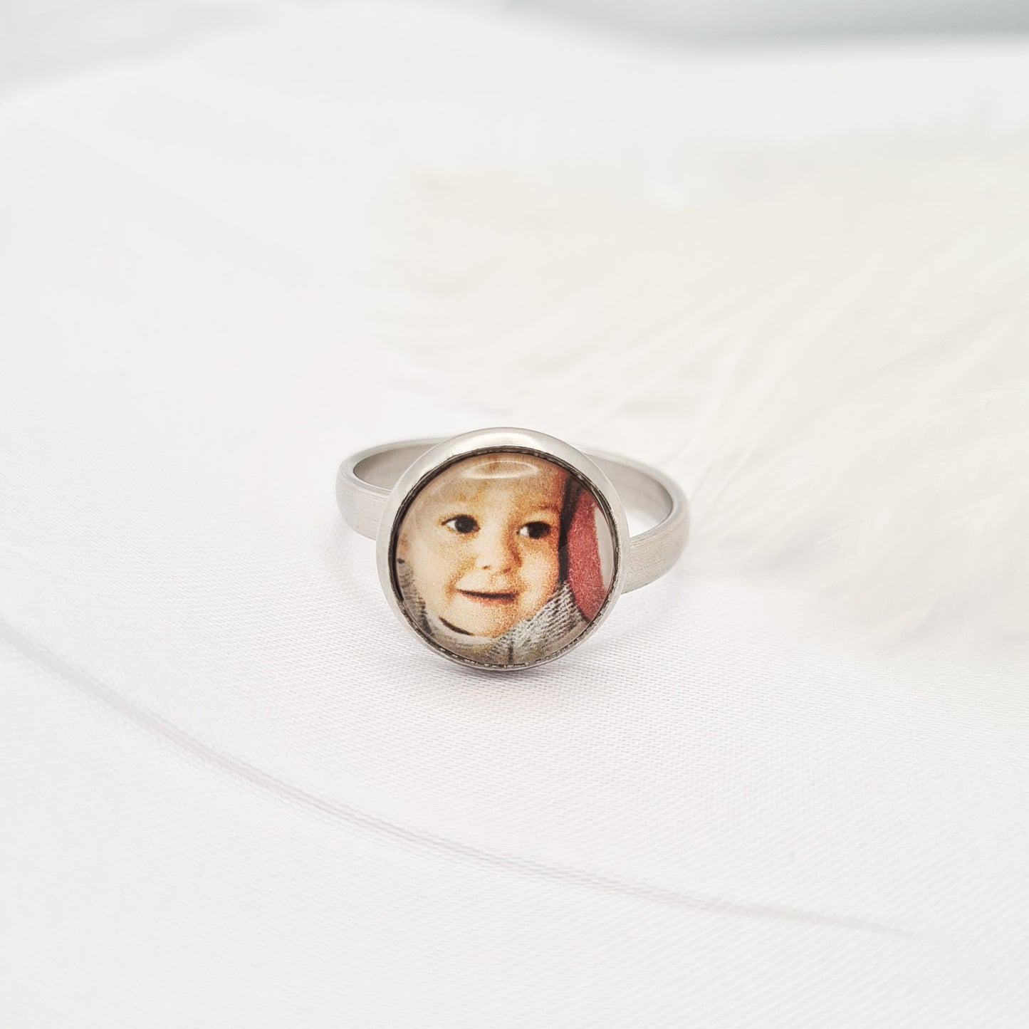 Stainless steel ring personalised with a photo set in glass