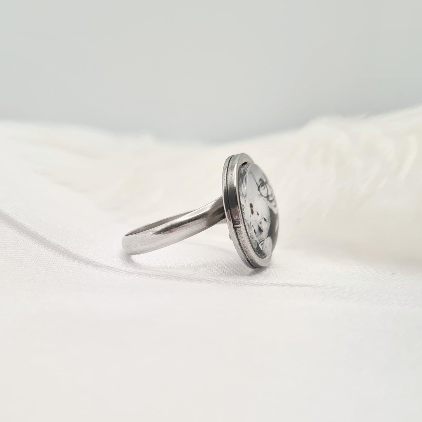 Stainless steel ring with personalised photo set in glass side view