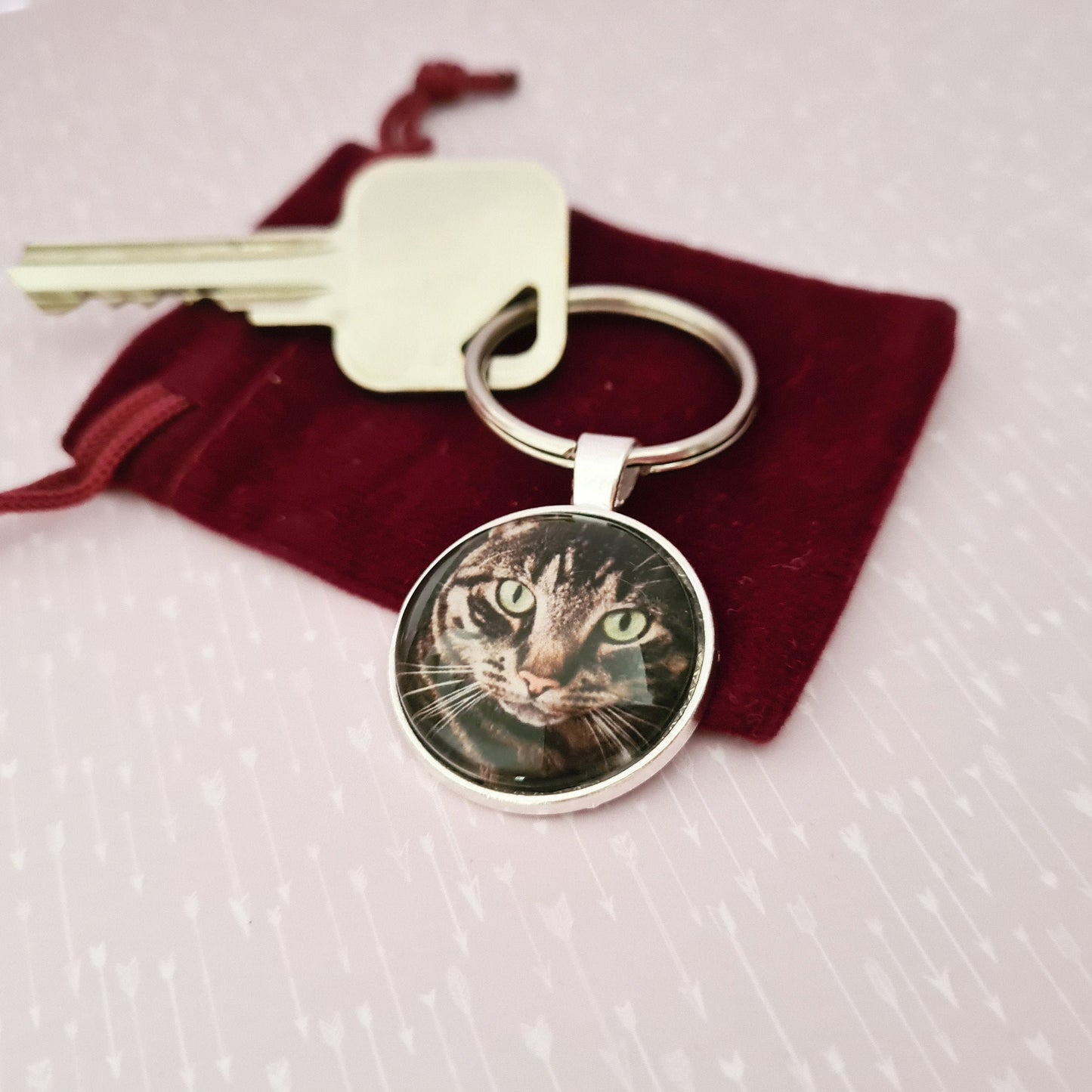 Stainless steel keyring with personalised pet photo set in glass with a decorative key