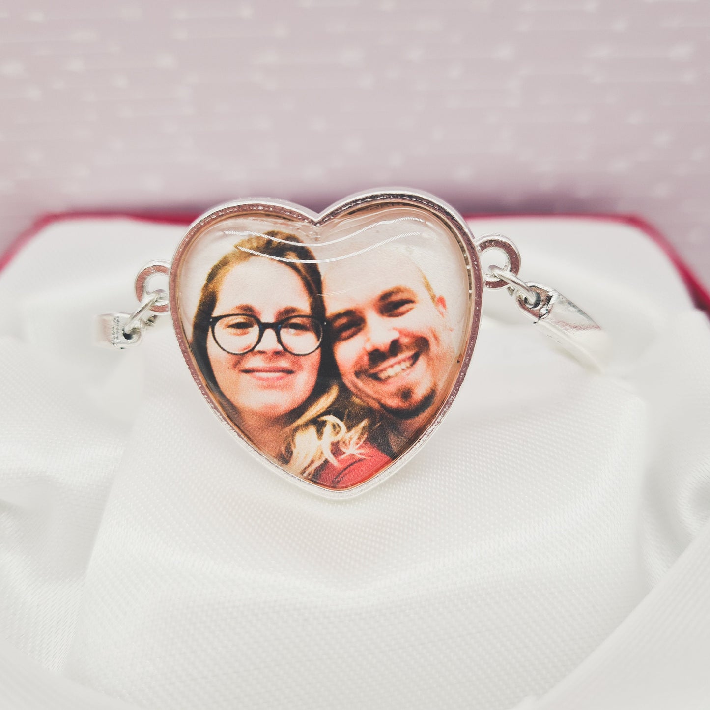 Silver heart shaped bracelet personalised with a photo set in glass close up of front