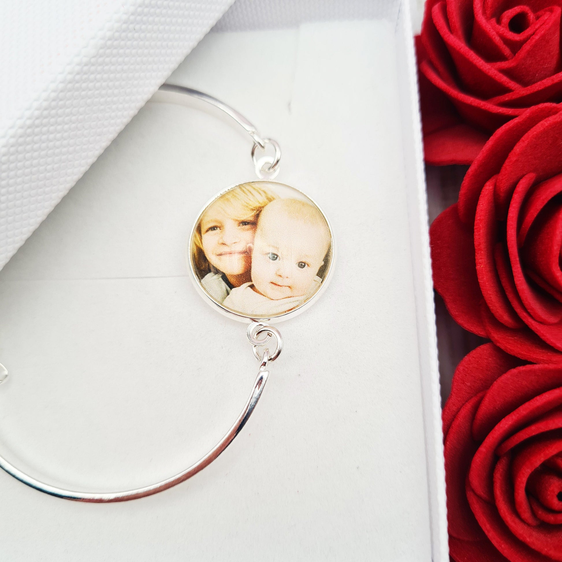 Silver bracelet with personalised photo set in glass inside a white gift box