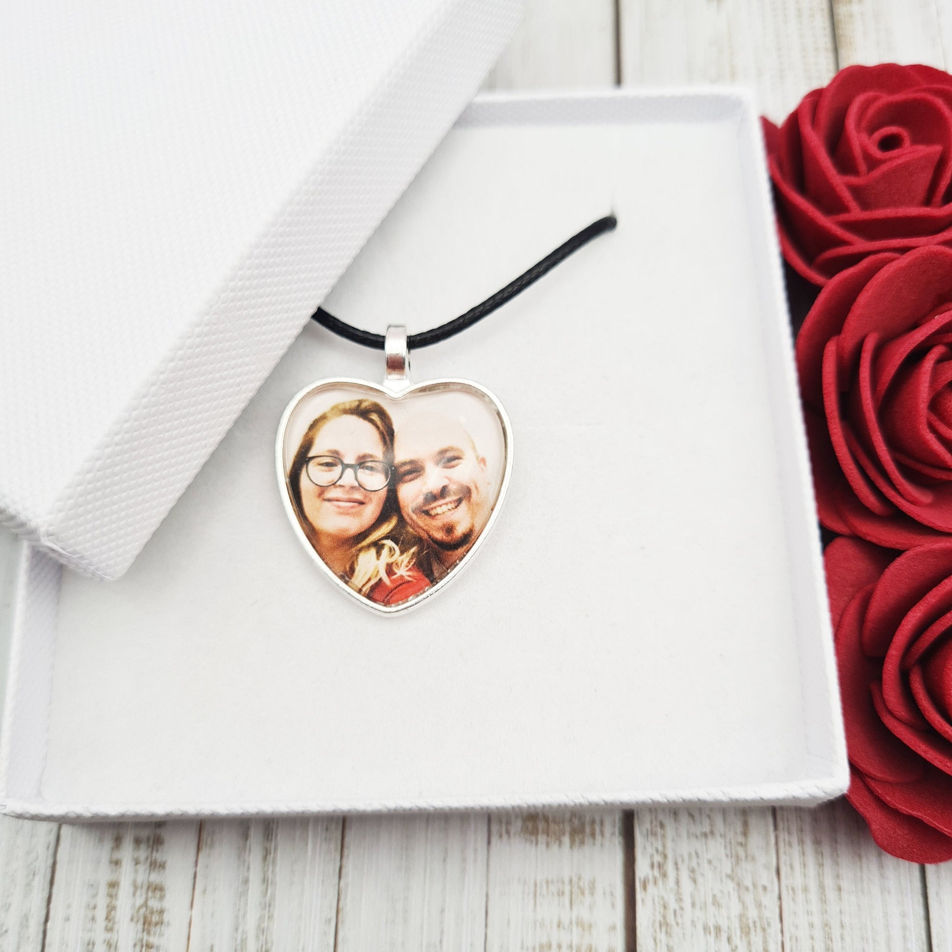 Silver heart shaped pendant with wax cord with a personalised photo set in glass inside a white box