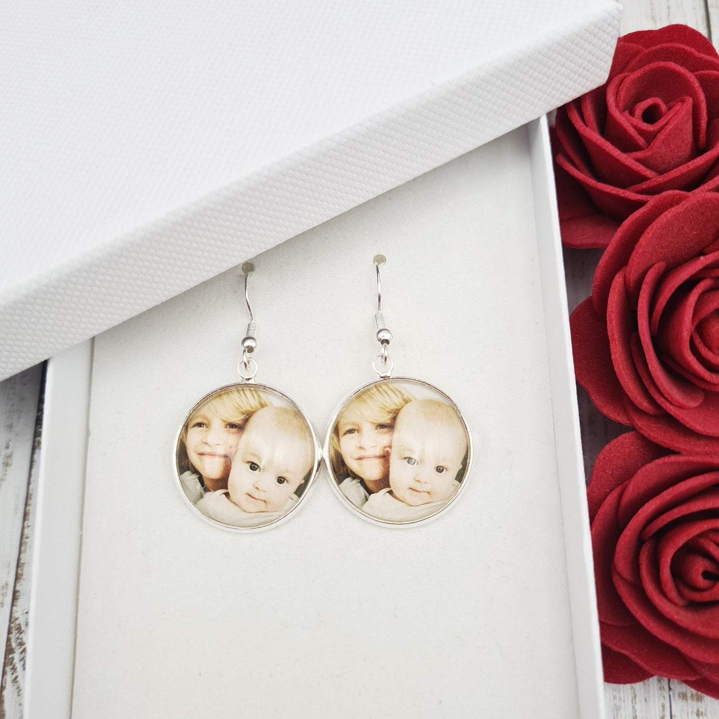 Silver earring set with personalised photo set in glass inside a white gift box