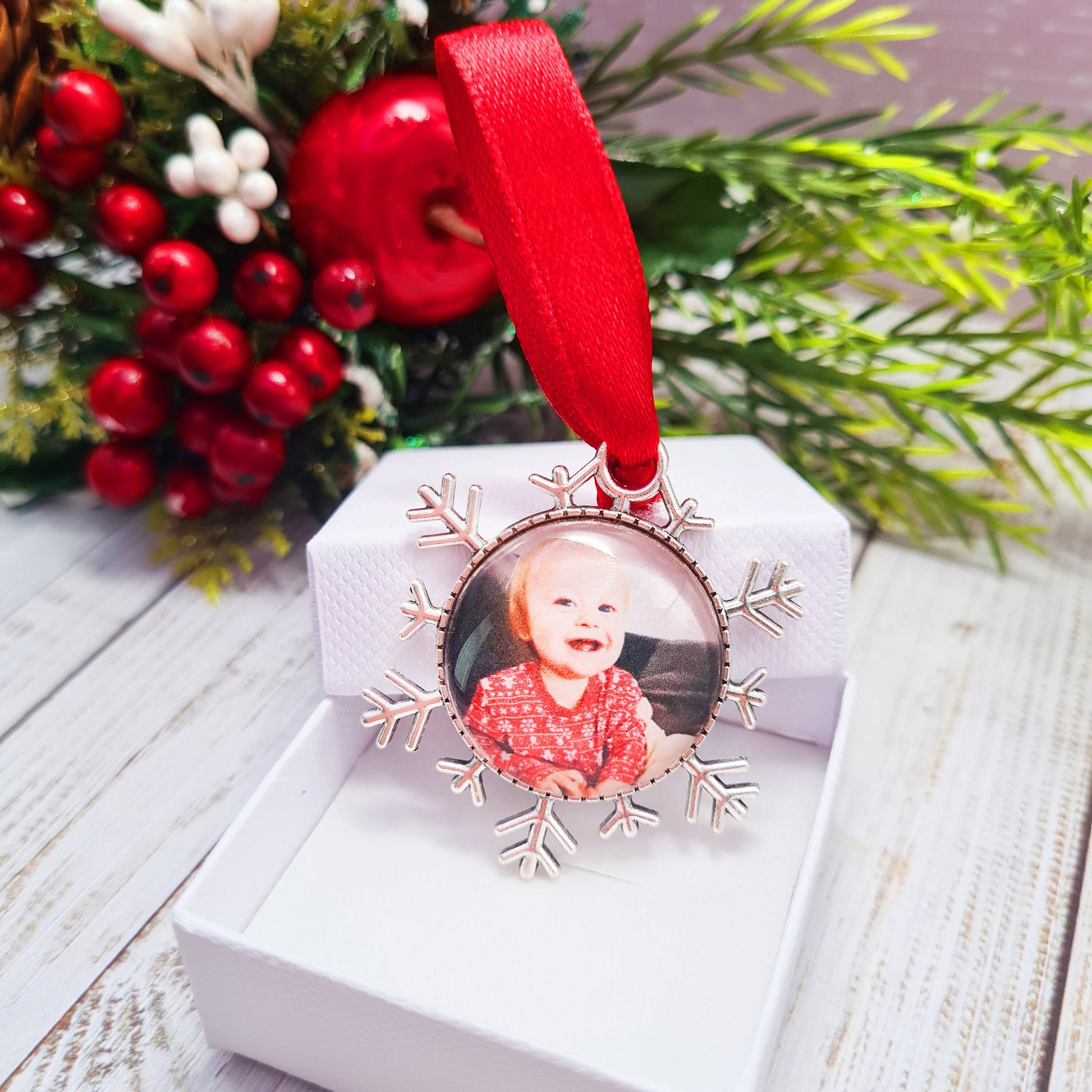Christmas ornament personalised with photo with red ribbon